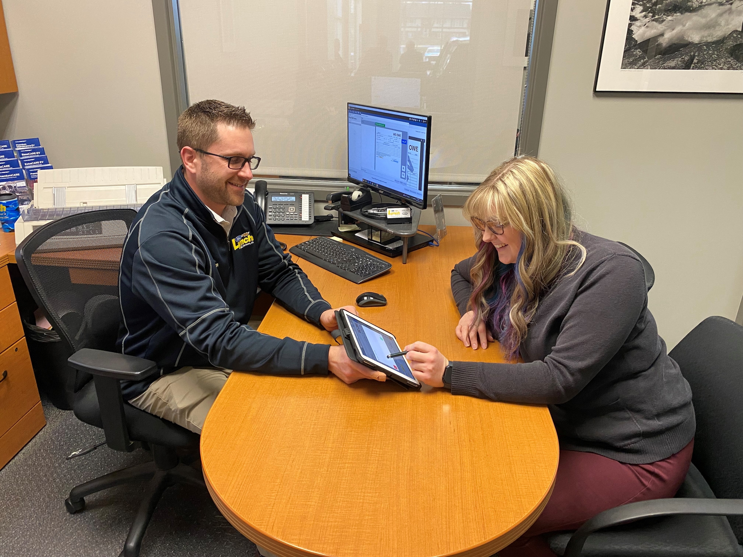 Happy customers buying a car!