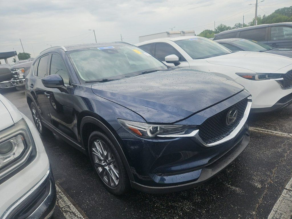 Used 2021 Mazda CX-5 Grand Touring with VIN JM3KFBDM3M1453438 for sale in Marion, IA