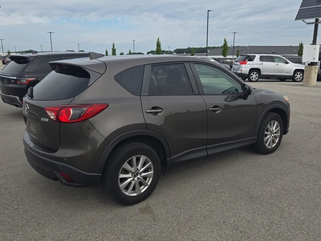 Used 2016 Mazda CX-5 Touring with VIN JM3KE2CY1G0835078 for sale in Marion, IA