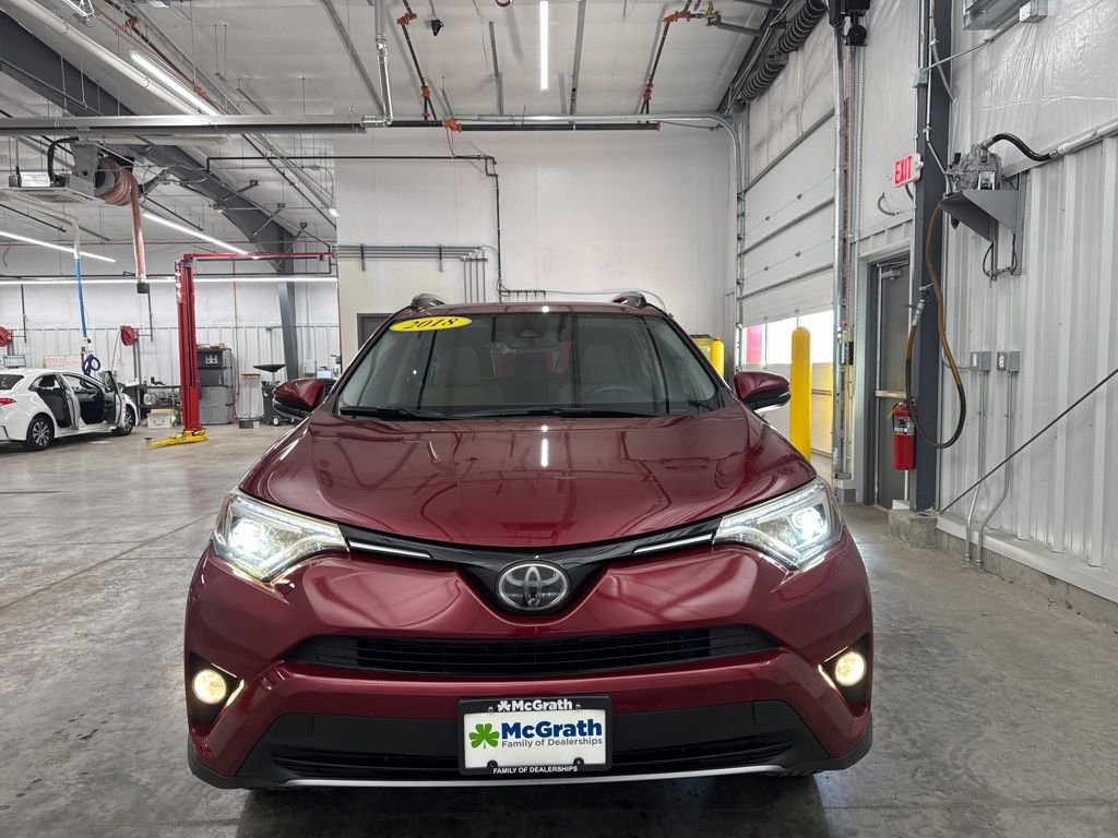 Used 2018 Toyota RAV4 Limited with VIN JTMYFREV1JD113881 for sale in Marion, IA