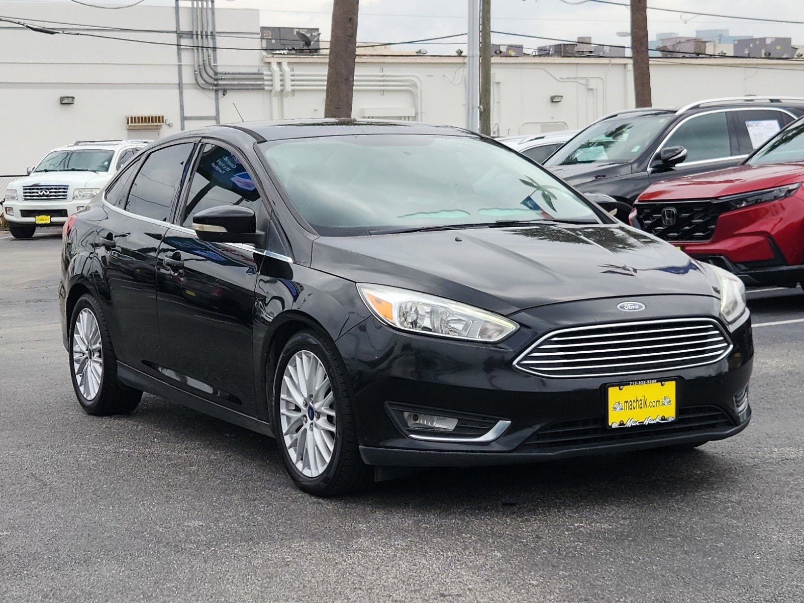 Used 2016 Ford Focus Titanium with VIN 1FADP3J22GL404558 for sale in Houston, TX