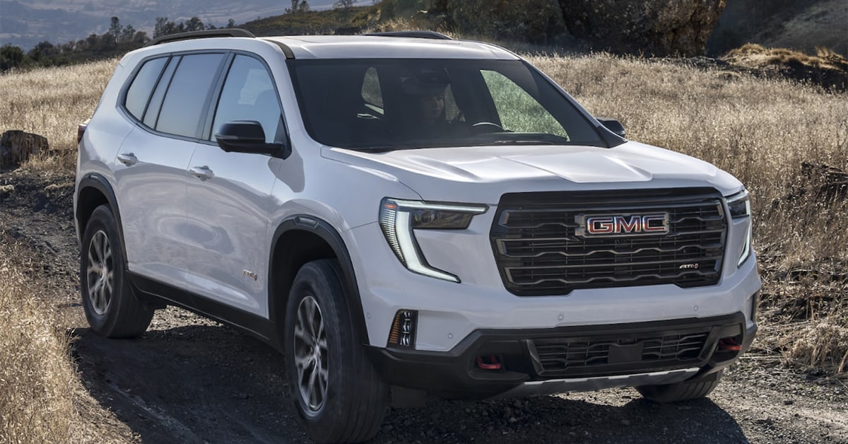 GMC ACADIA 2025 driving through wet roads.jpg
