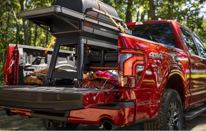 Red Truck carrying a grill