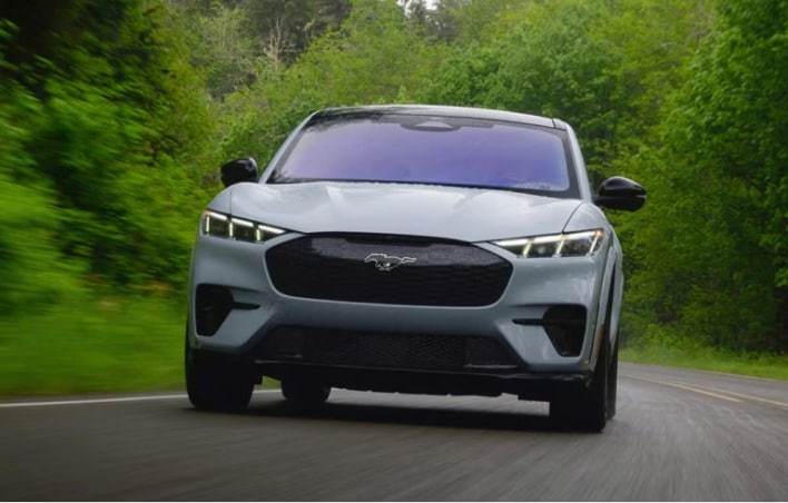 Ford SUV driving on road