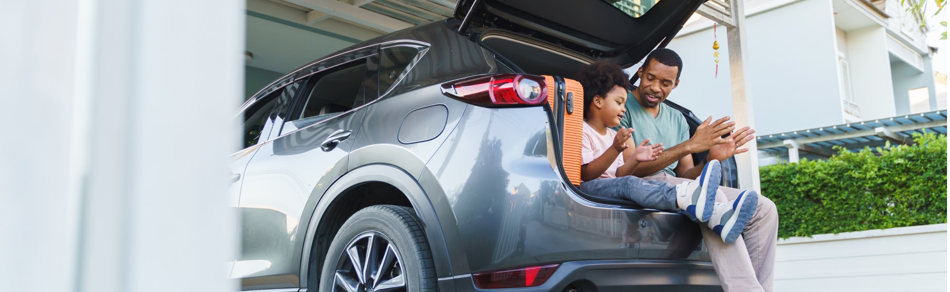 Family sitting in a Ford Suv