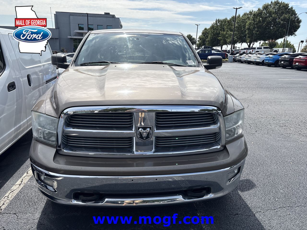 Brown (Austin Tan Pearlcoat Light Graystone Pearlcoat) 2010 Dodge RAM 1500 Pickup Truck Four-Wheel Drive 5-Speed Automatic