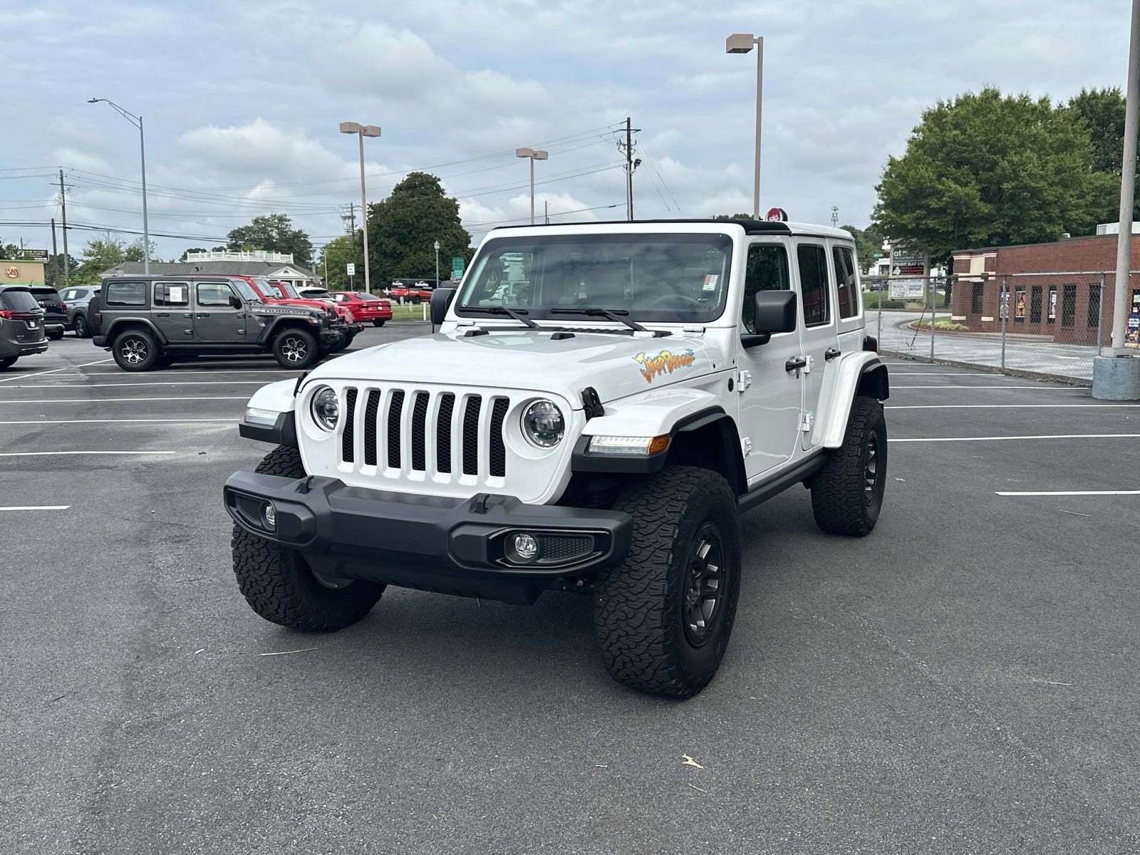 Used 2023 Jeep Wrangler 4-Door Sport with VIN 1C4HJXDG6PW665704 for sale in Buford, GA