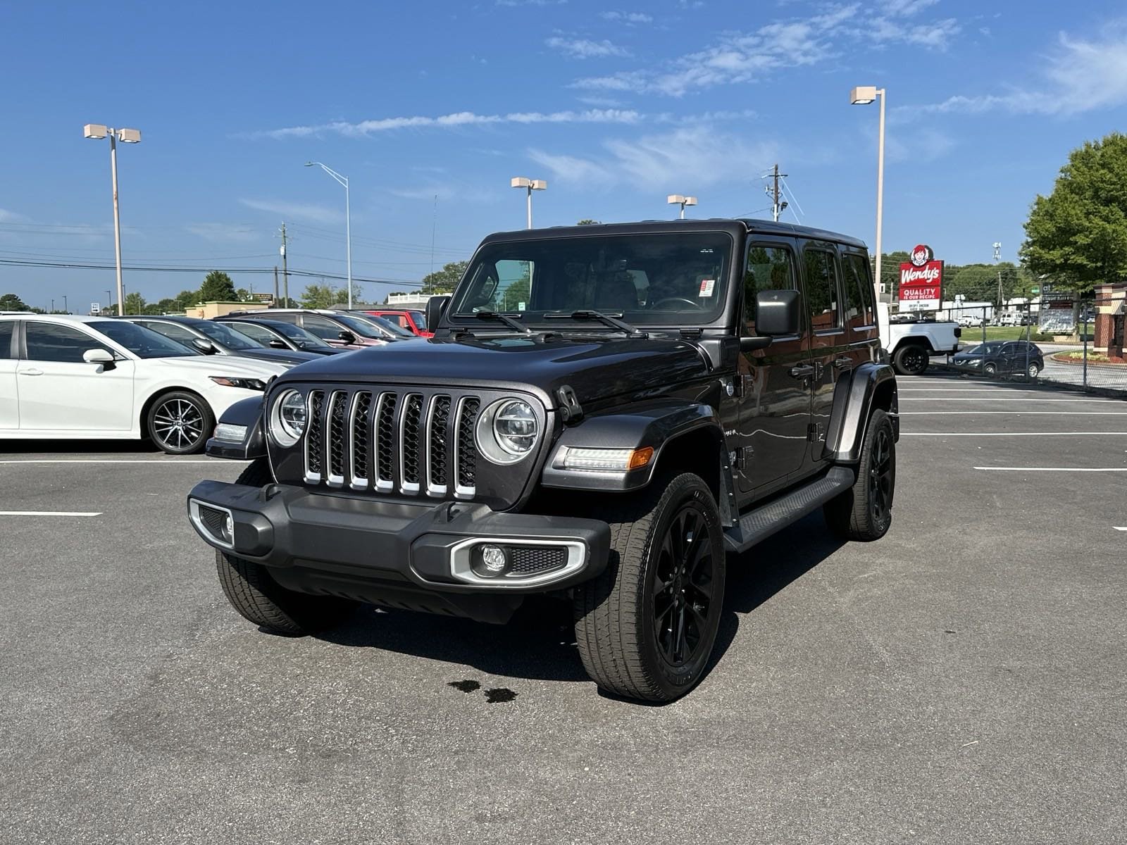 Used 2021 Jeep Wrangler Unlimited Sahara 4XE with VIN 1C4JJXP68MW682536 for sale in Buford, GA