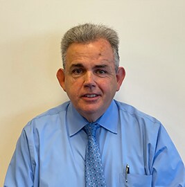 Staff member DENNIS SLOYAN from 2deee87178f6