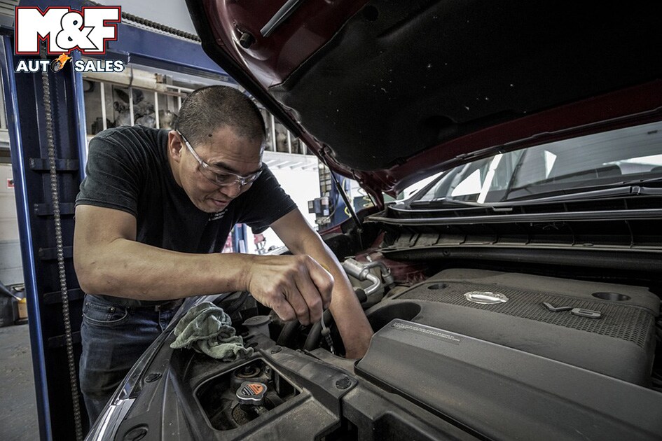Auto Service Technician Repairing a Vehicle
