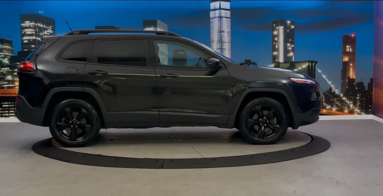 Used 2015 Jeep Cherokee Altitude with VIN 1C4PJMCS4FW755741 for sale in New York, NY