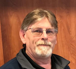 Staff member John Hewitt from ID_389247