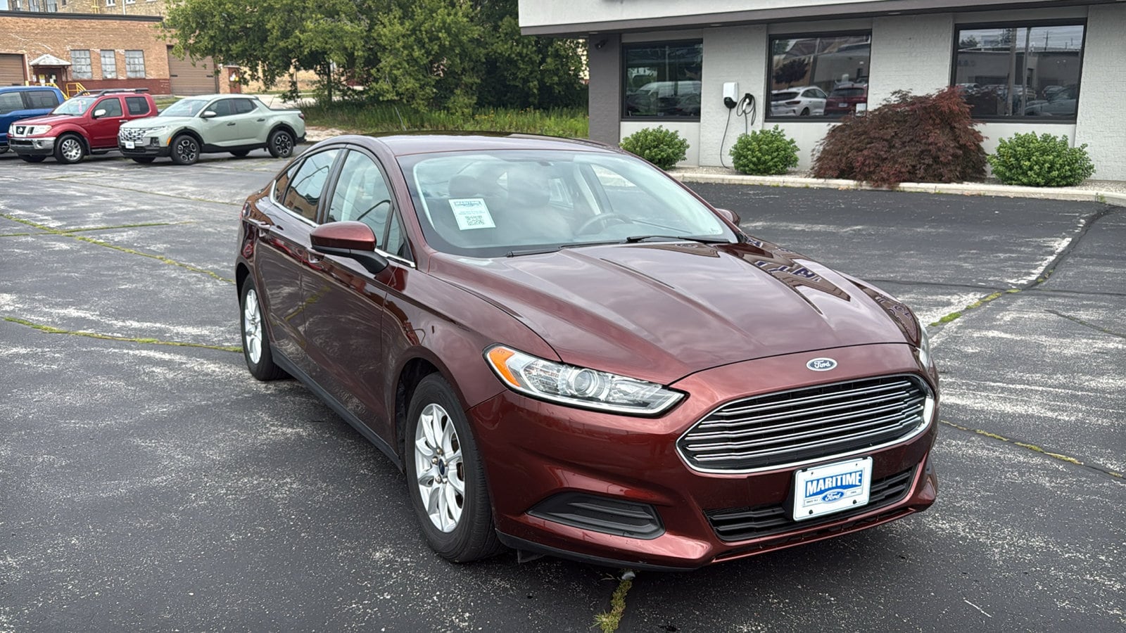 Used 2015 Ford Fusion S with VIN 3FA6P0G77FR220615 for sale in Manitowoc, WI