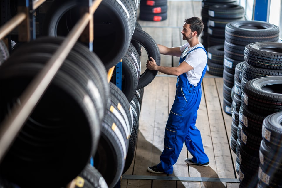 Mechanic Selecting New Tires for a Tire Change