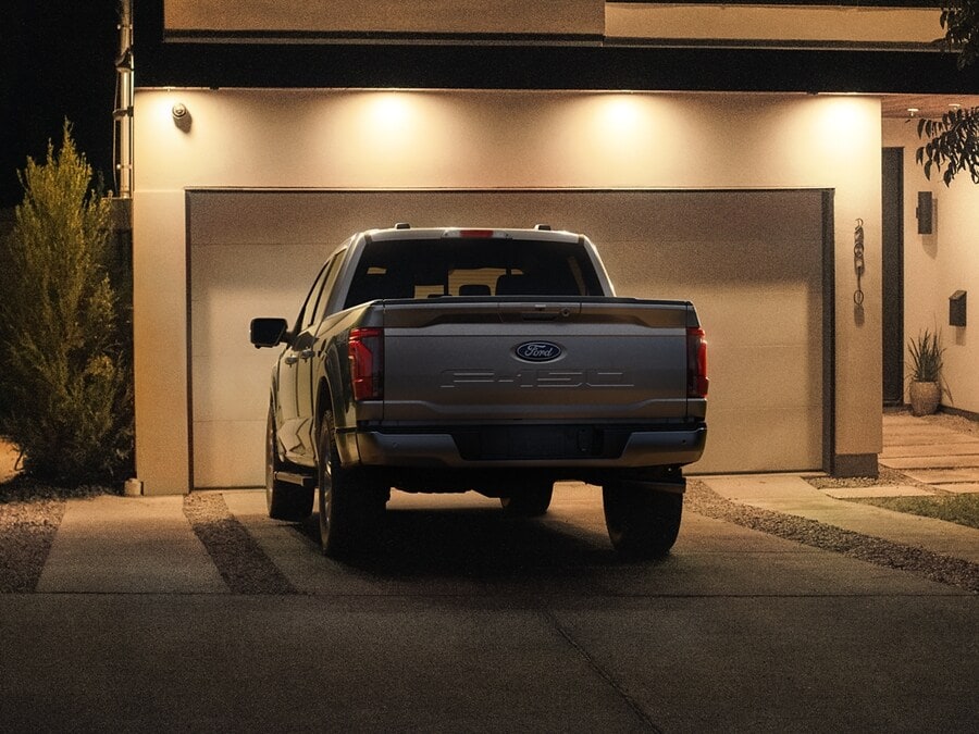 2024 Ford F150® PowerBoost® Hybrid pickup being driven on an open road