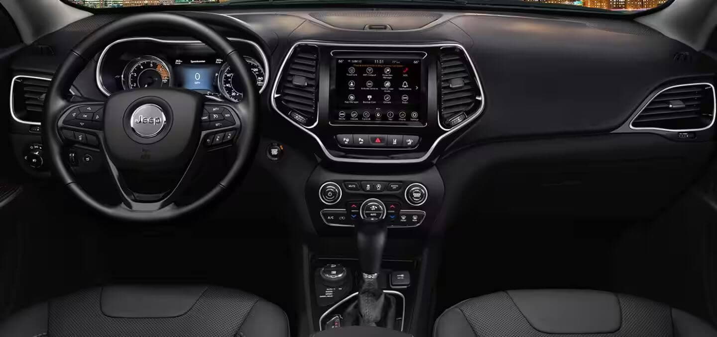 Learn which Jeep models feature a heated steering wheel, like the Jeep Cherokee Interior shot of the Jeep Cherokee, showing the steering wheel, dashboard, and various controls.