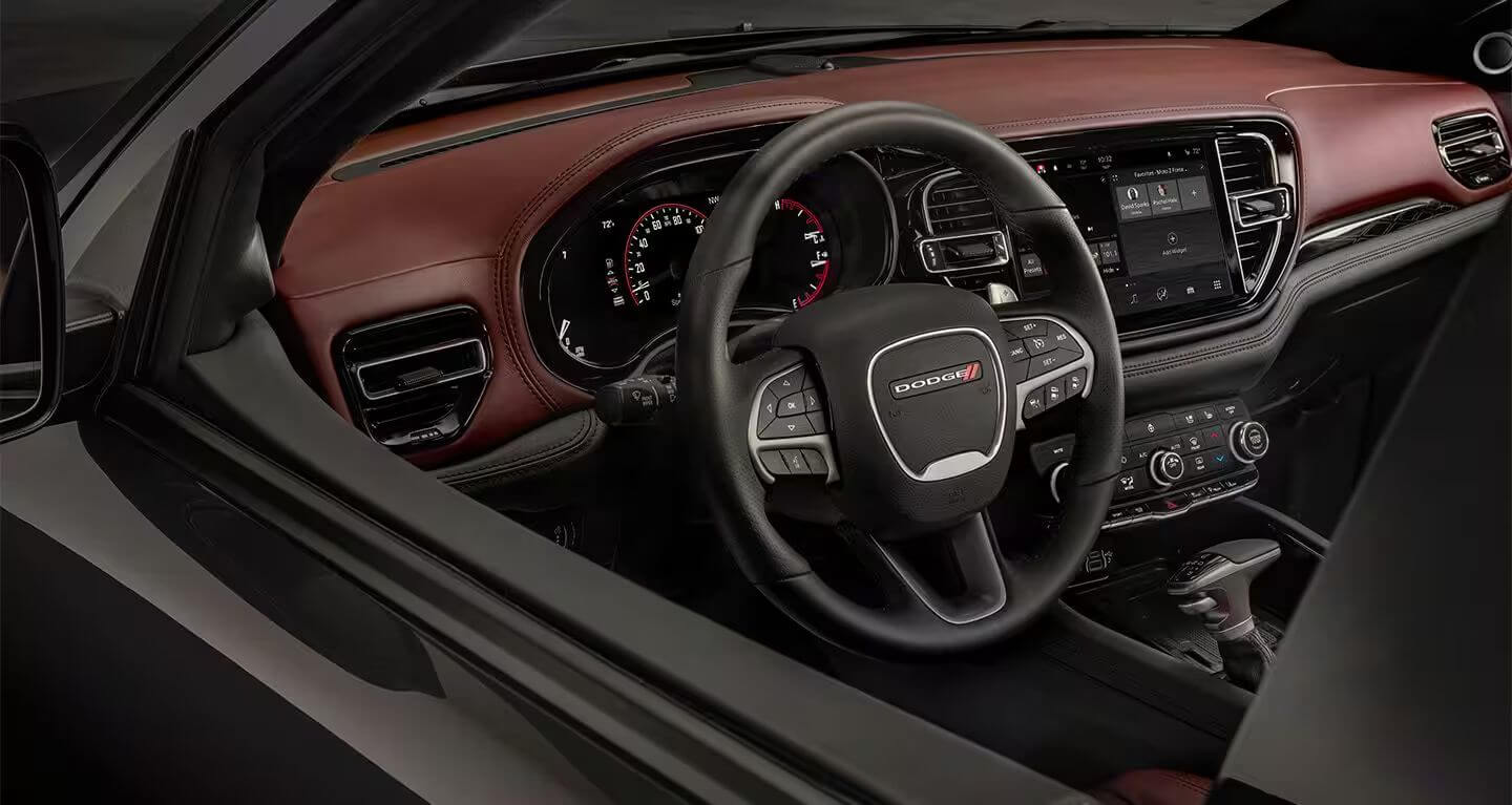 Learn which Dodge models feature a heated steering wheel, like the Dodge Durango Interior shot of the Dodge Durango, showing the steering wheel, dashboard, and various controls.