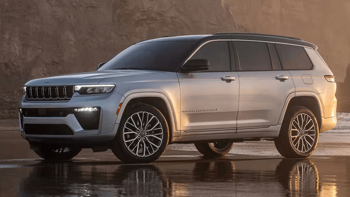 A Jeep Grand Cherokee parked on a beach