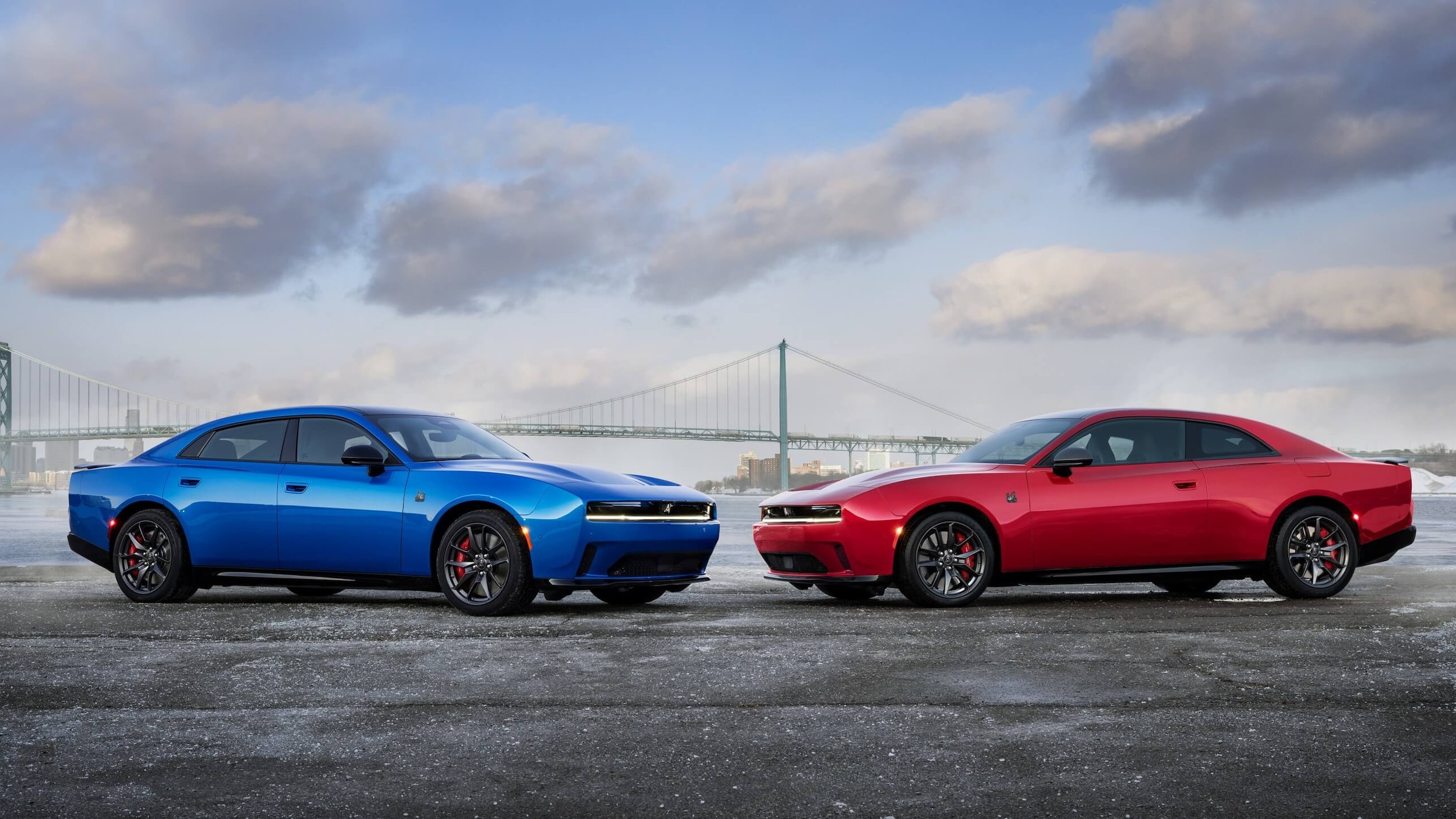 Two Dodge Chargers parked facing each other