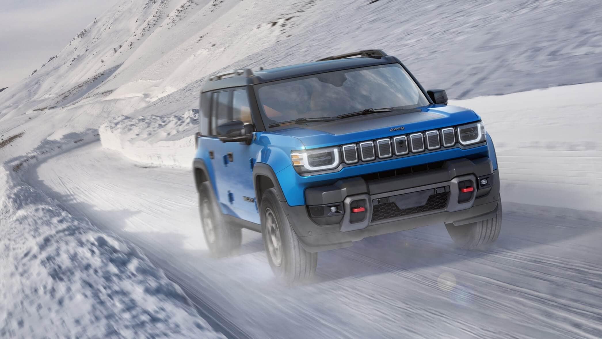 Jeep Recon driving on a snow-covered road