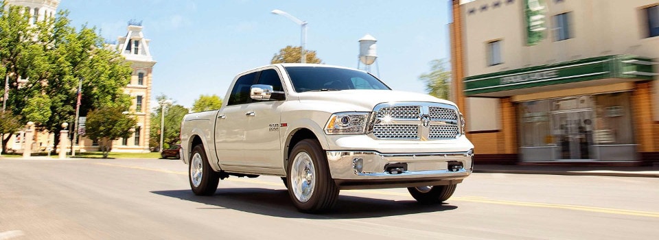 2018_Ram_1500_Laramie_PearlWhiteDriving.jpg.image.1440.jpg