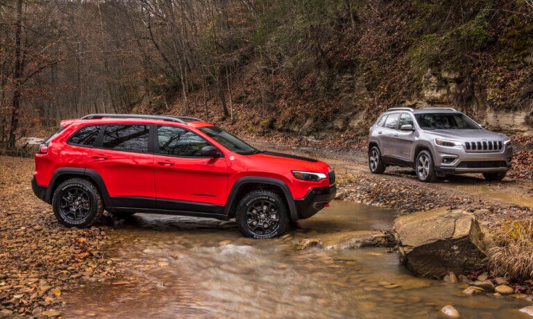 2020 Jeep Cherokee exterior 2 offroad by stream in woods