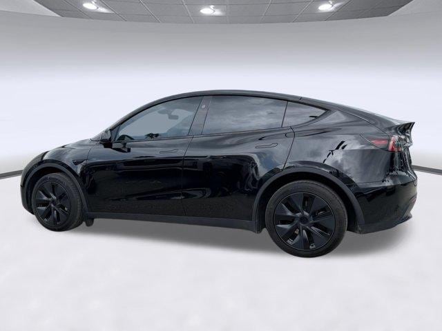 Used 2025 Tesla Model Y Long Range with VIN 7SAYGDEE7SF247582 for sale in Orlando, FL