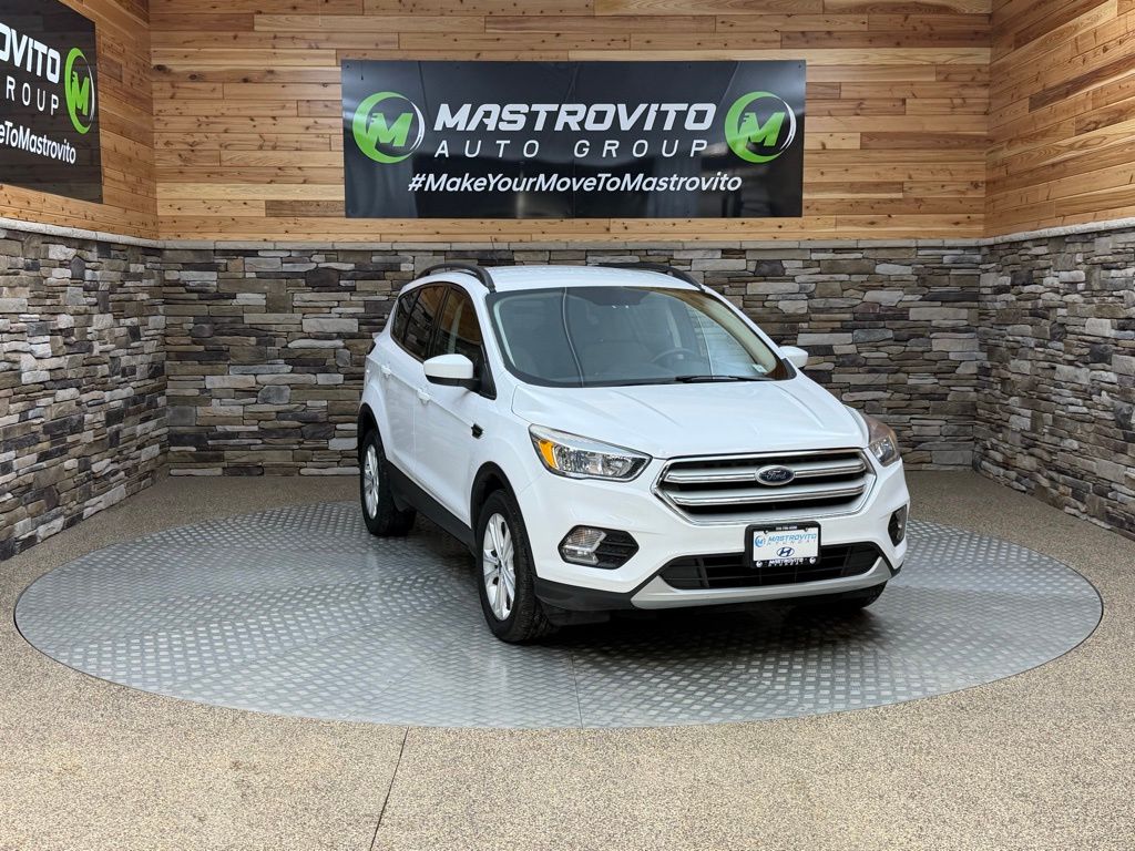 Used 2018 Ford Escape SE with VIN 1FMCU9GD0JUC20288 for sale in New York Mills, NY