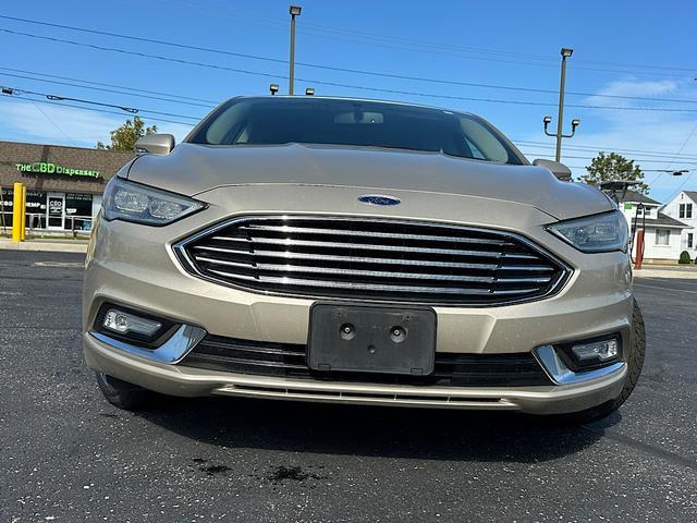 Used 2017 Ford Fusion Hybrid Titanium with VIN 3FA6P0RU4HR360062 for sale in Sandusky, OH