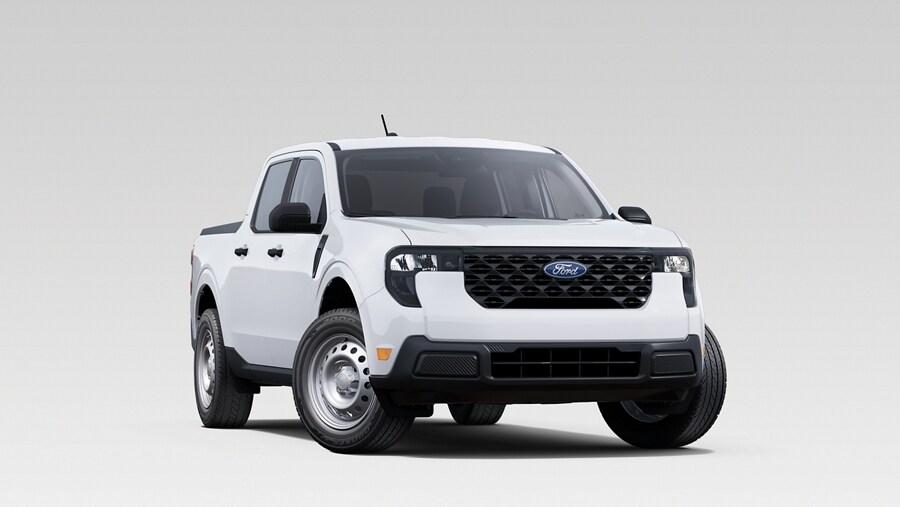Profile view of a blue Ford Maverick® Lobo™ pickup parked in front of a restaurant patio