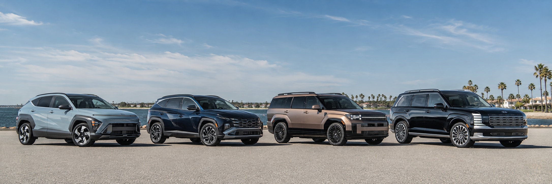 Hyundai Kona, Tucson, Santa Fe, and Palisade SUVs lined up from smallest to largest