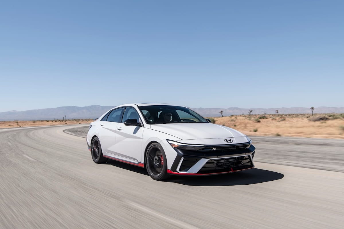 2026 Hyundai Elantra N performance sedan driving on a curved road