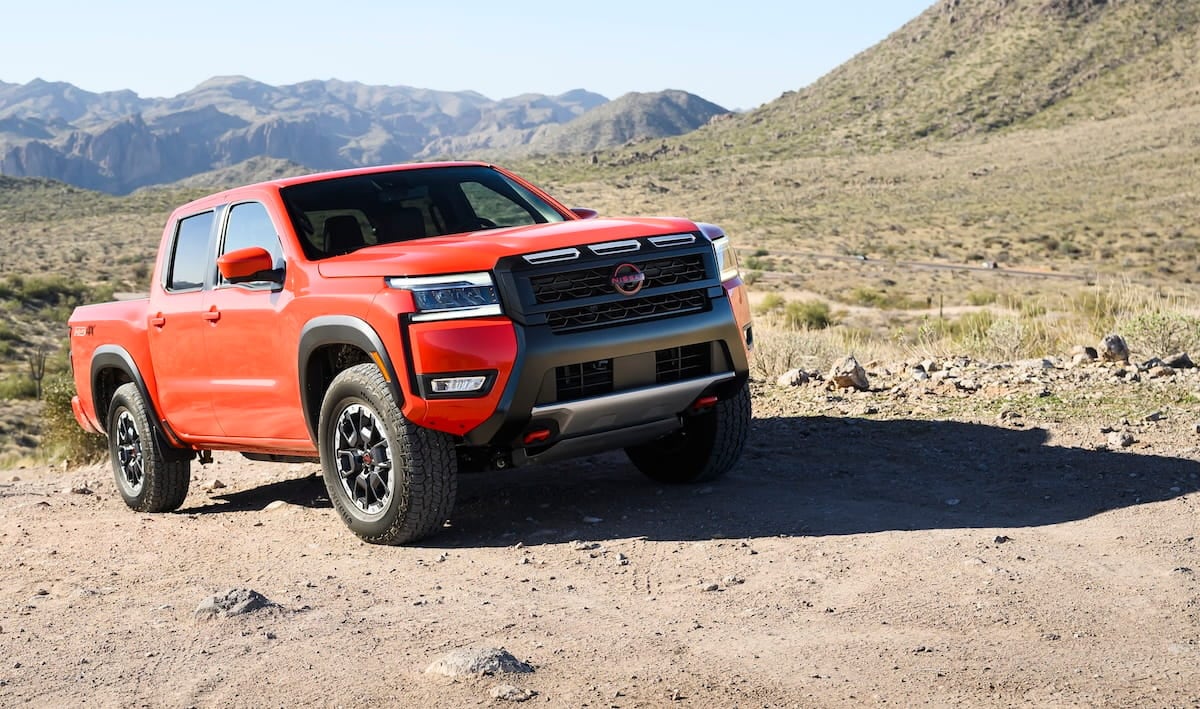 Orange 2026 Nissan Frontier PRO-4X Crew Cab on a rocky trail