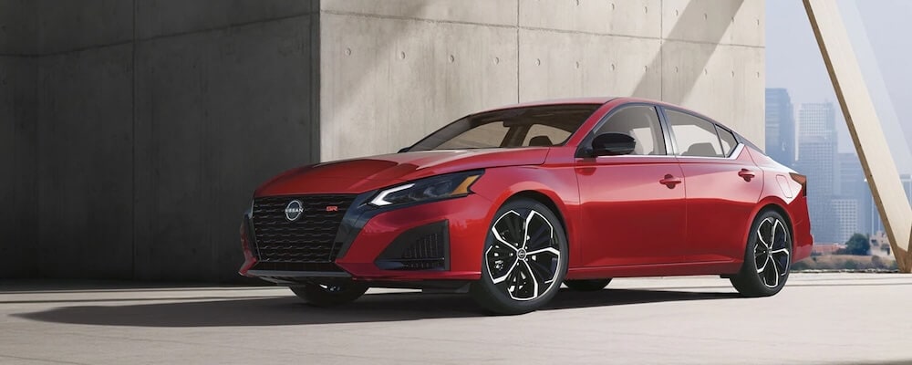 Front three-quarter view of a red 2026 Nissan Altima SR