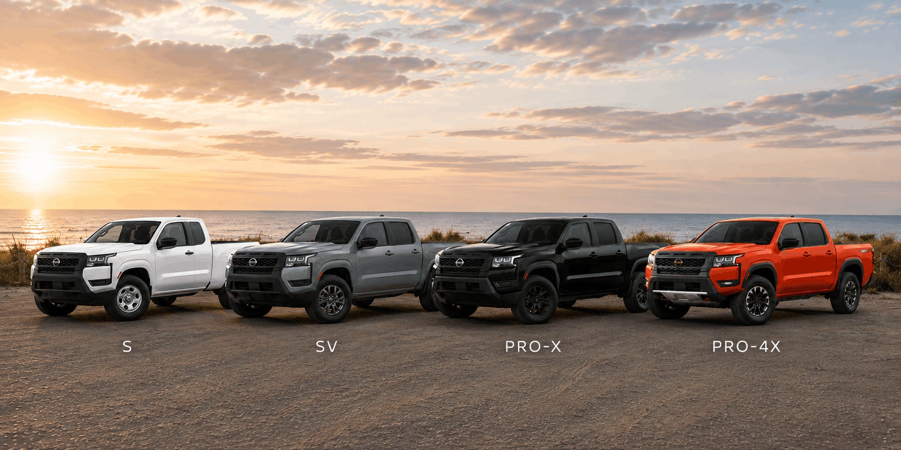 2026 Nissan Frontier S, SV, PRO-X, and PRO-4X trims lined up along the coast