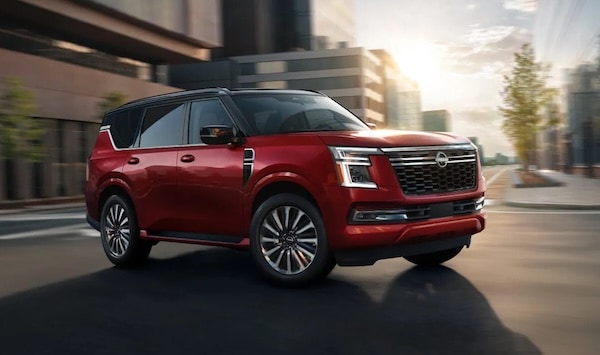 a red 2026 Nissan Armada driving on the street
