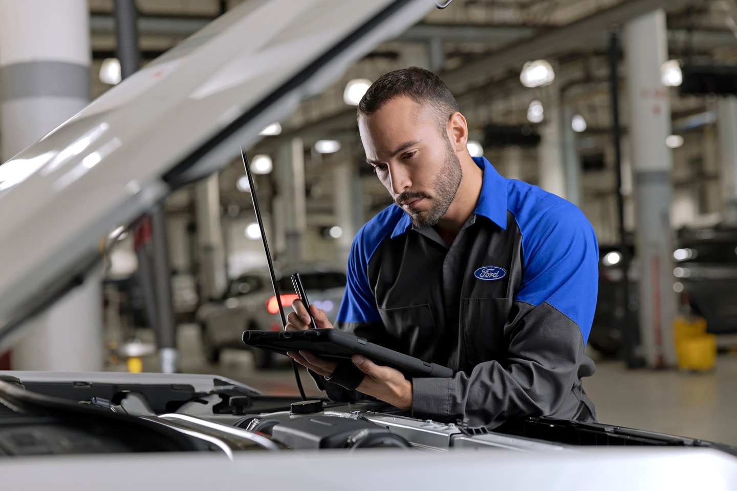 Ford Service Member Inspecting Vehicle