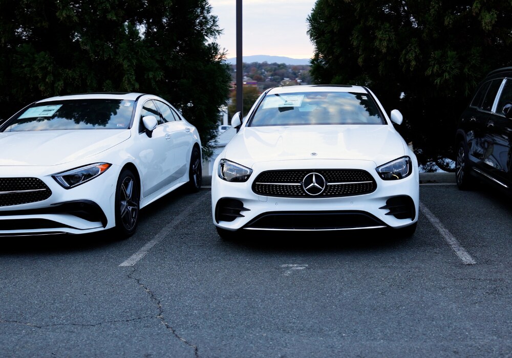 Two Mercedes-Benz service specials parked in the lot at Mercedes-Benz Charlottsville