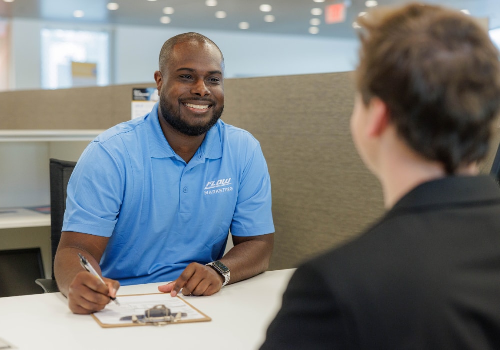 mercedes-cvl-financing.png two people sitting at a desk signing paperwork