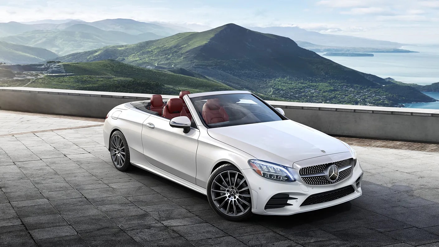 White 2023 Mercedes-Benz C-Class Cabriolet cruising