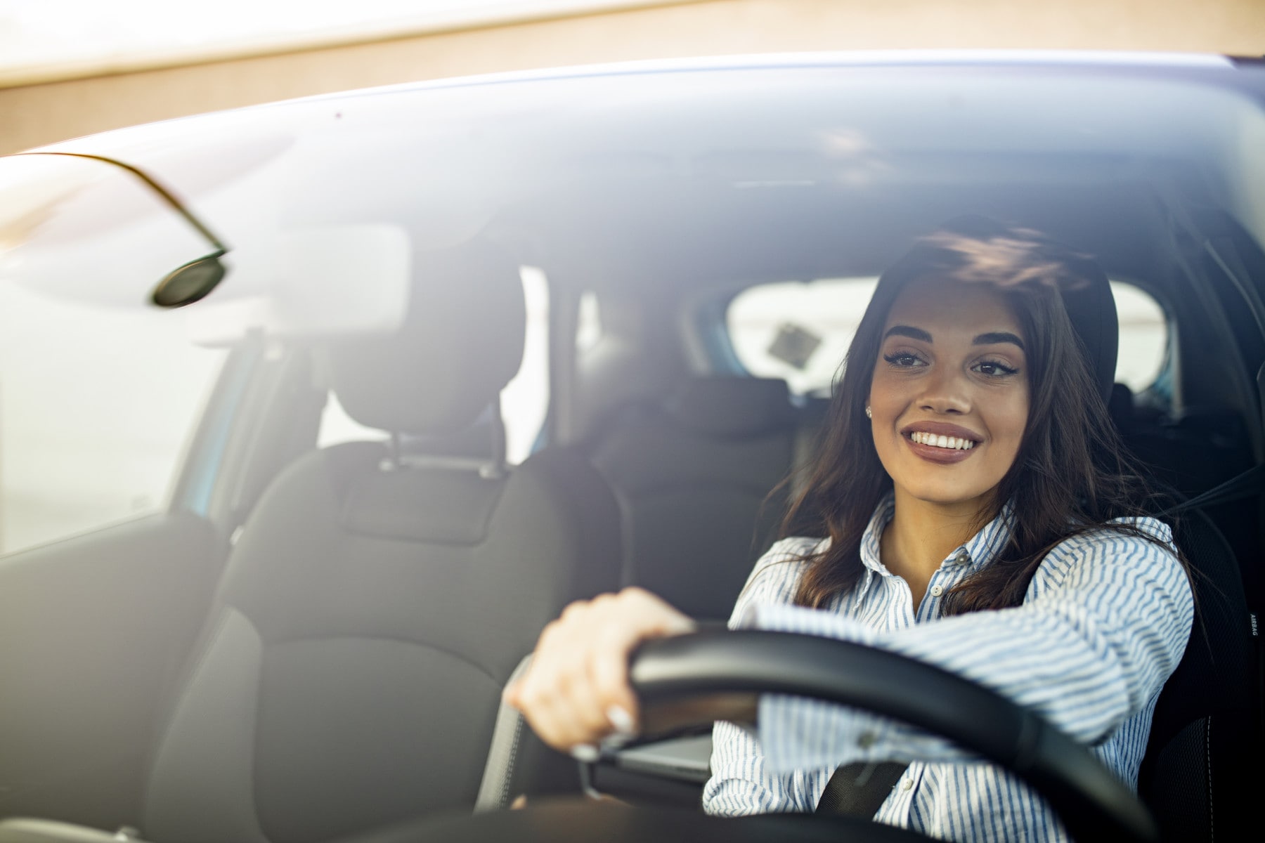 Woman test driving a car