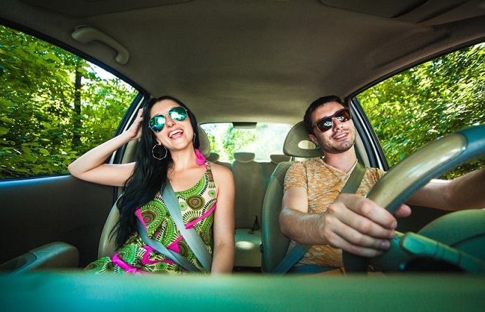 Couple driving on a sunny day image