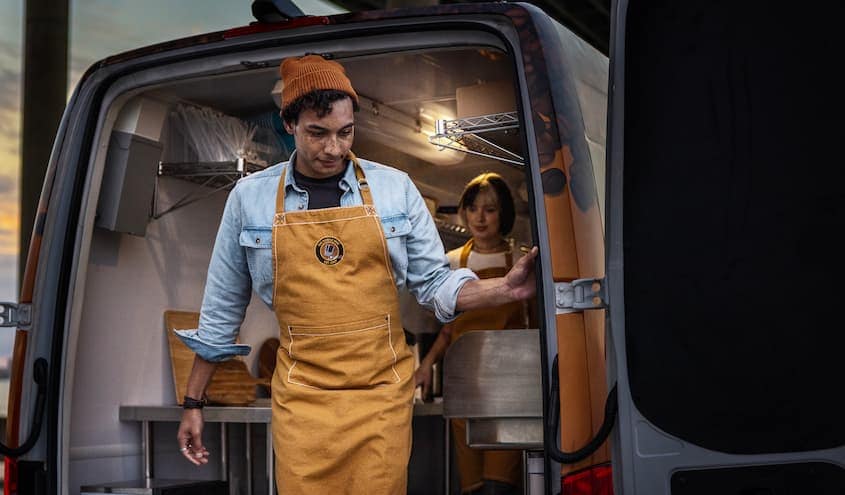 Section 179 - Hotel Van.jpg Mobile coffee shop employees opening the back of a Mercedes-Benz van.
