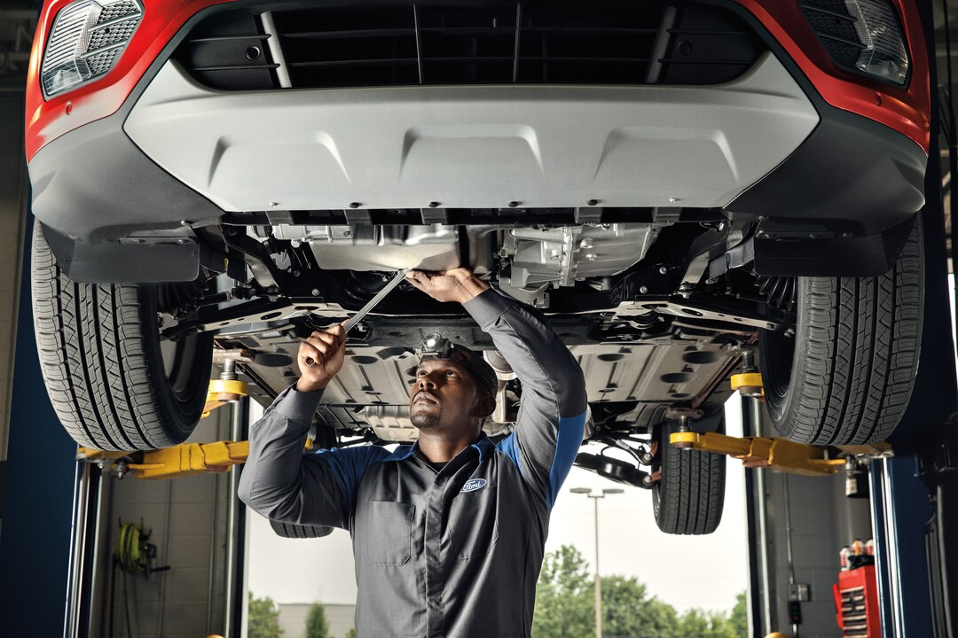  Service technician working on vehicle