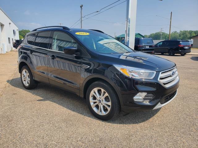 Used 2018 Ford Escape SE with VIN 1FMCU9GD6JUC22367 for sale in Clare, MI