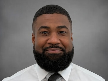 Staff member Pollini Reed from ID_a1e71ca2d440