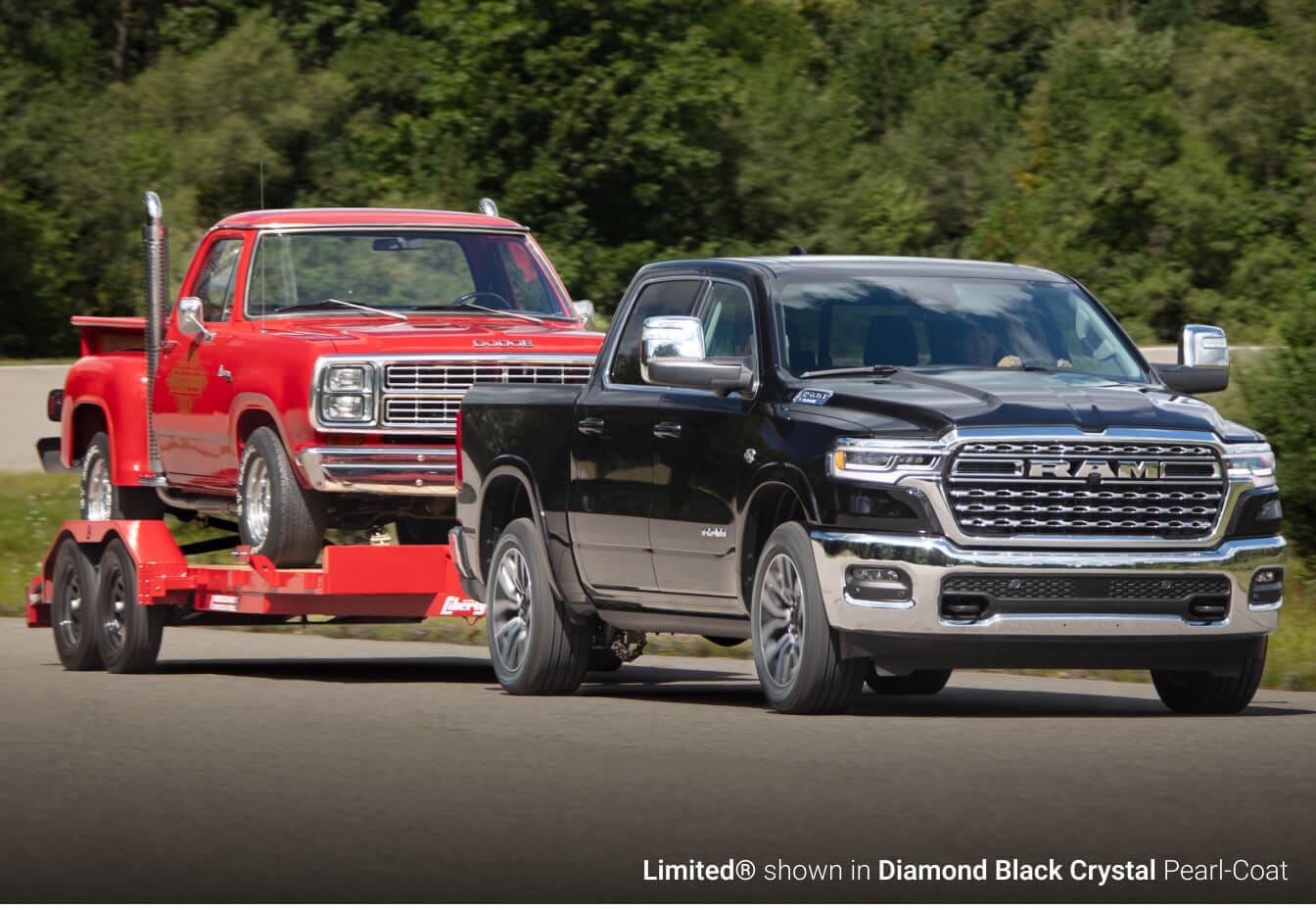 2026 Ram 1500 Limited in Diamond Black towing a vintage red truck