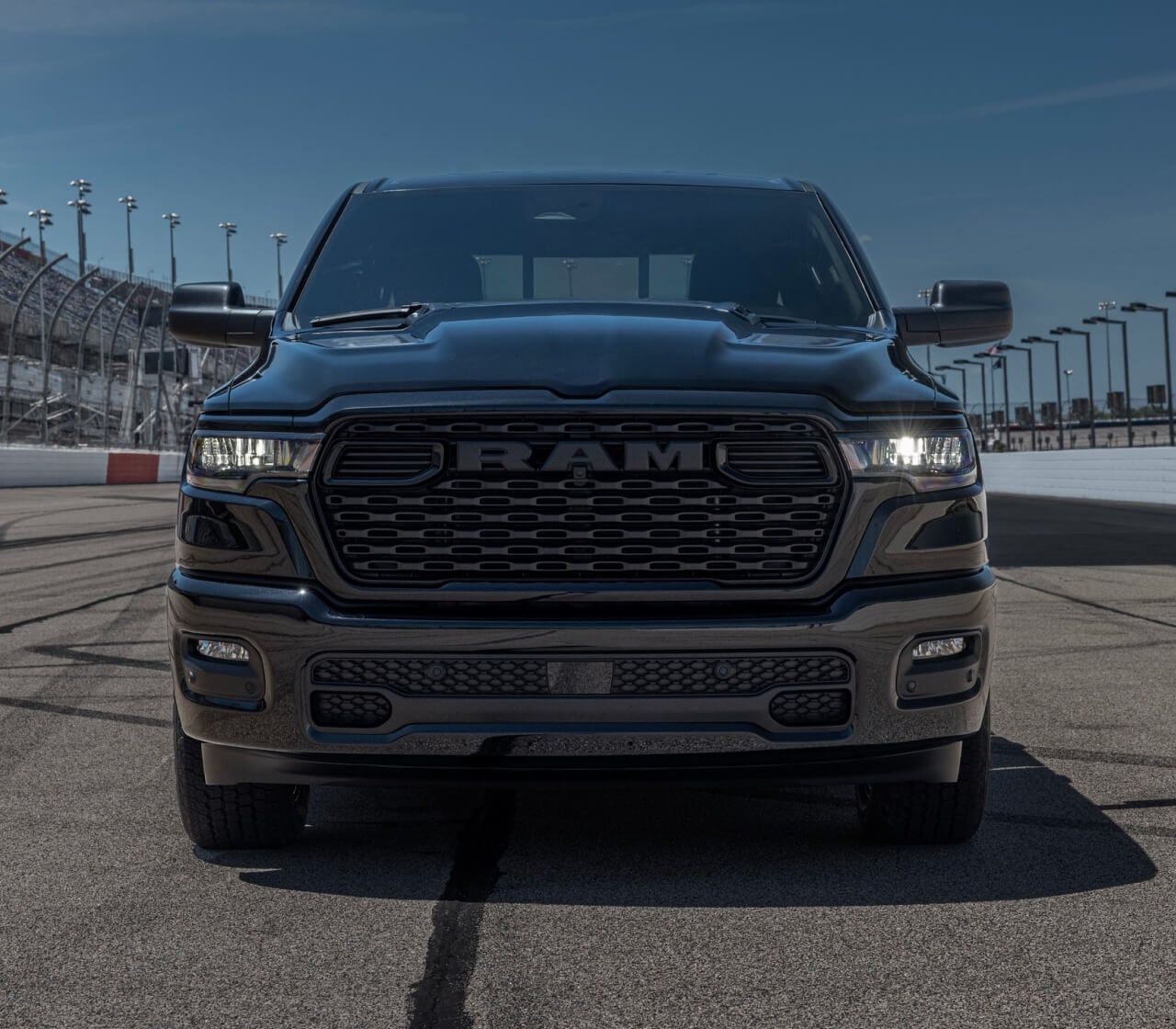 2026 RAM 1500 in black on a racetrack