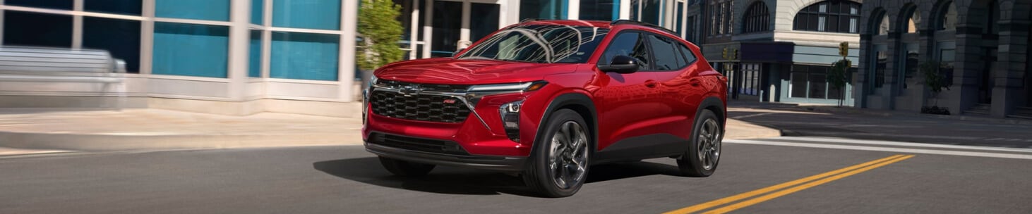 2026 Chevrolet Trax in Red on a city street