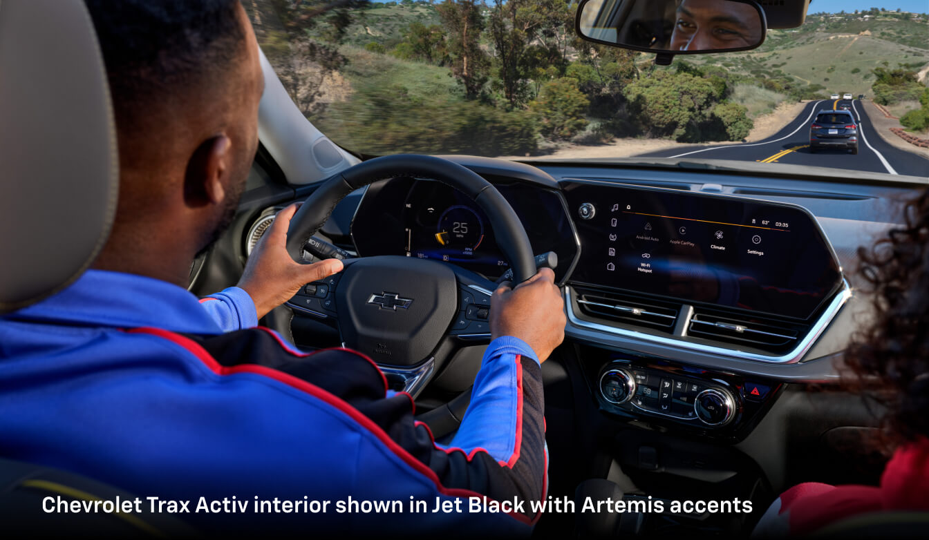 Interior shot of a man driving his 2026 CHevy Trax